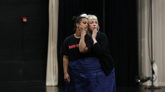 April Sellers and Kenna Cottman share material during an Informal Showing