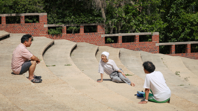 Kenta Nagai, Nishimura, and Yamazaki in discussion at the Owen Sellers Amphitheater