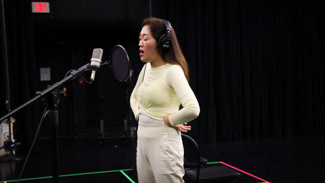 Melody H. Shim during vocal recording session