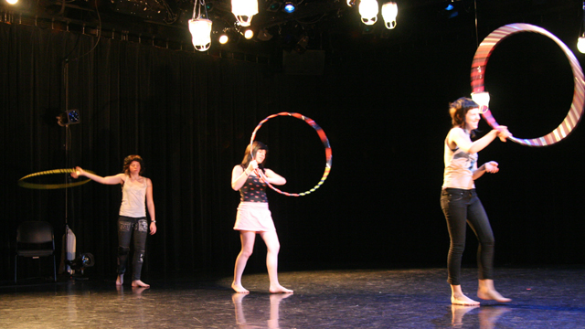 Hula hoopers explore a small shared motion at the direction of Emily Johnson.