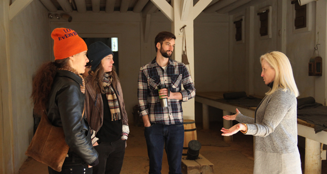 Dr. McEwan talks with Thorson, Van Loon and Wirsing in a reconstructed Spanish Fort.